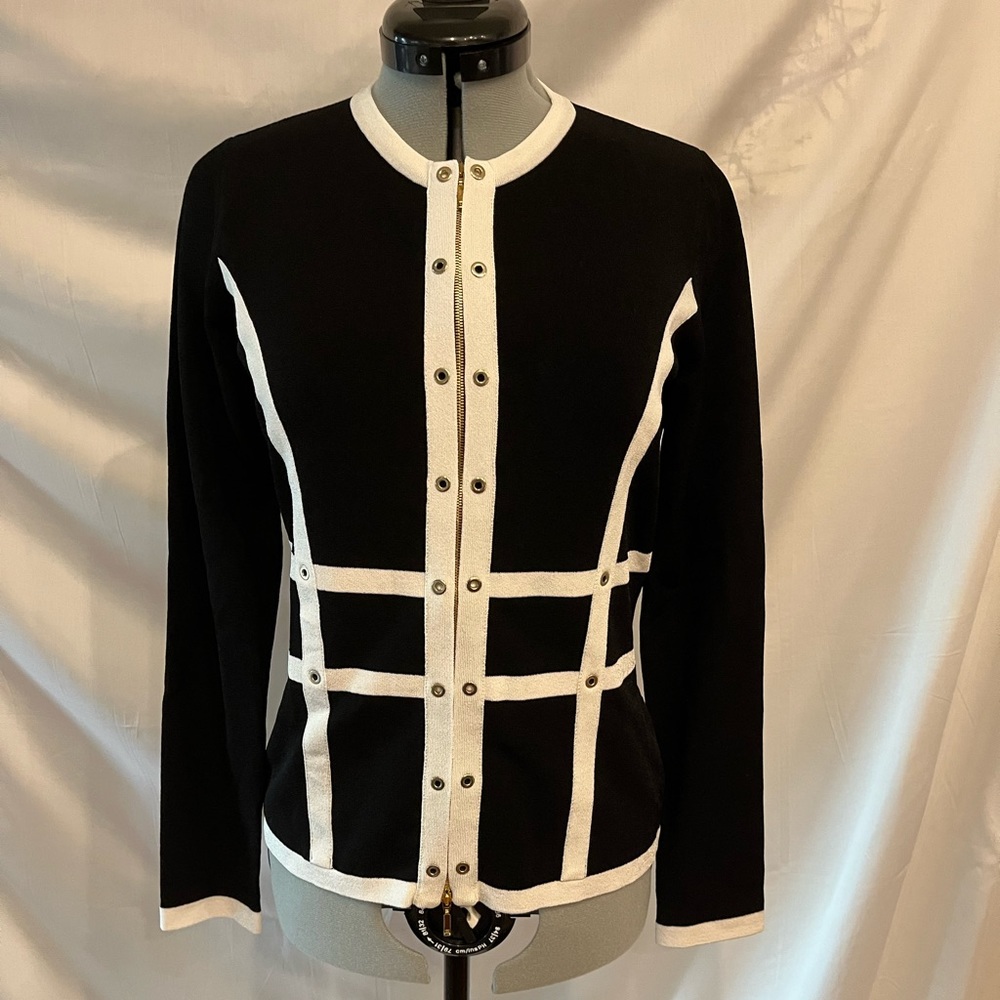 Zip up sweater. Never worn. New condition